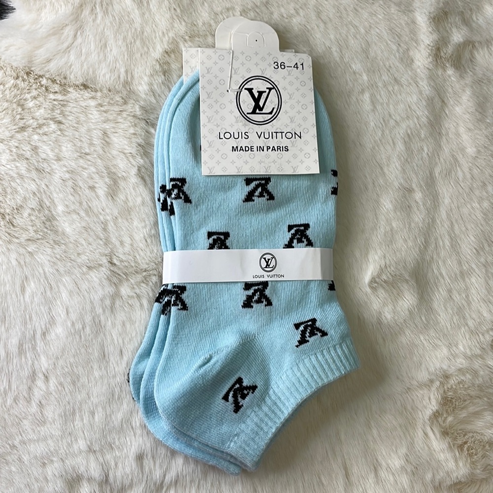 Louis Vuitton. Two pair, light blue no-show socks with logo. Size 36-41. NWT